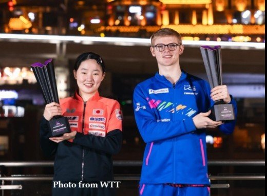 Felix Lebrun and Miwa Harimoto post with their trophy after winning WTT Champions Chongqing